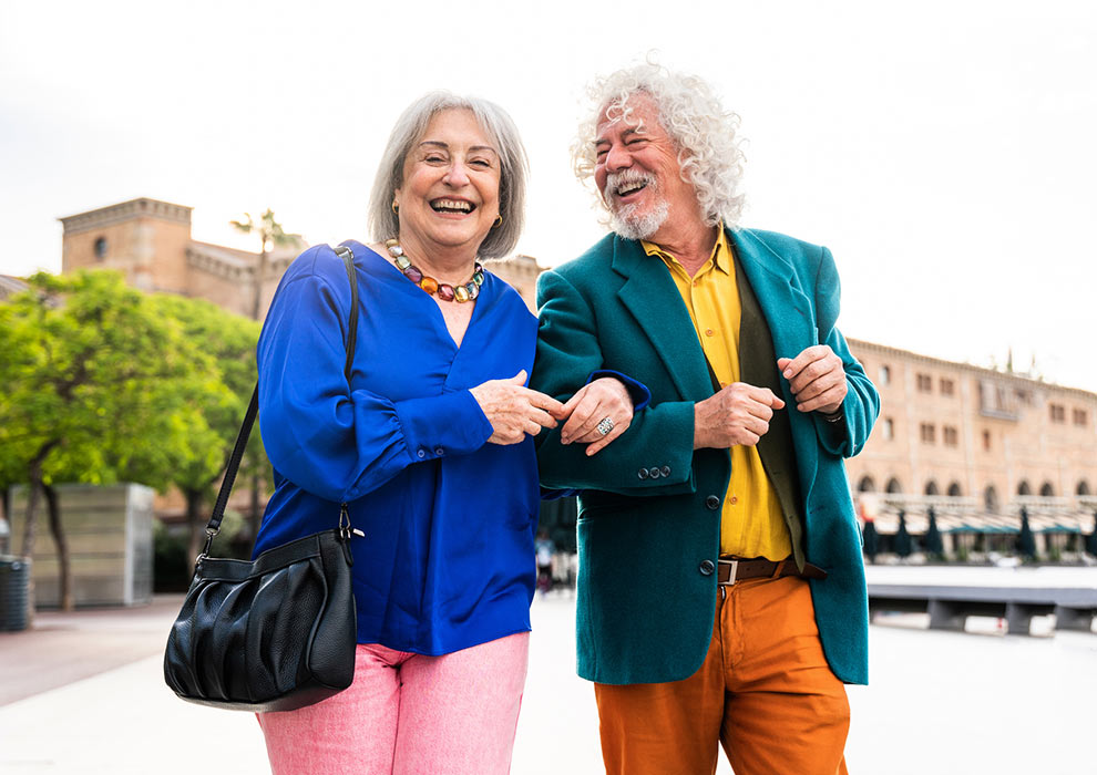 Mature couple walking outdoors.