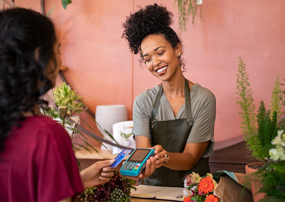 Woman paying for purchase with a card.